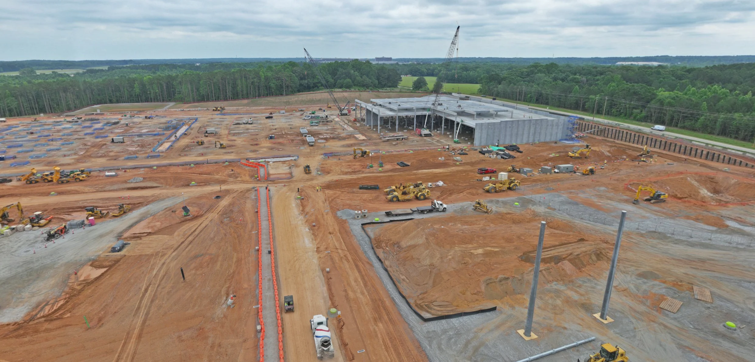 Aerial view of active sitework and industrial construction